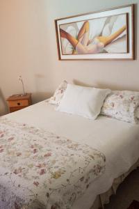 Voodi või voodid majutusasutuse Departamento Grande en San Alfonso del Mar toas