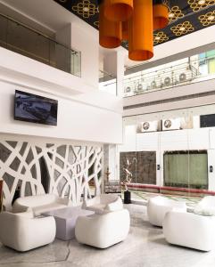 TV a/nebo společenská místnost v ubytování Hotel Oxina Lygon