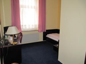 Postel nebo postele na pokoji v ubytování Hotel Wettin