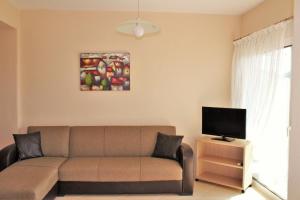 A television and/or entertainment centre at Theodora Villas