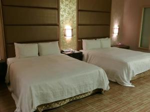Letto o letti in una camera di Mambo Impression Motel