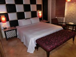 Letto o letti in una camera di Mambo Impression Motel