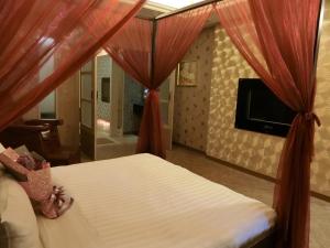 Letto o letti in una camera di Mambo Impression Motel