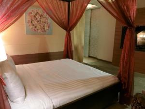 Letto o letti in una camera di Mambo Impression Motel