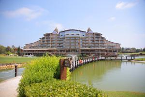 a large building on a bridge over a body of water at Sueno Hotels Golf Belek in Belek