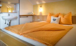 Letto o letti in una camera di Hauserhof am Goldberg