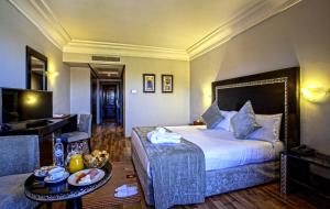 TV a/nebo společenská místnost v ubytování Palm Plaza Marrakech