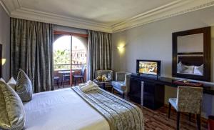 Postel nebo postele na pokoji v ubytování Palm Plaza Marrakech