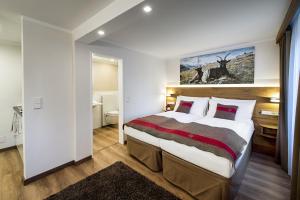 Postel nebo postele na pokoji v ubytování Apartments Butterfly Zermatt