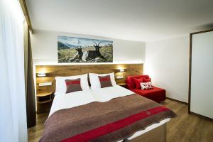 Postel nebo postele na pokoji v ubytování Apartments Butterfly Zermatt