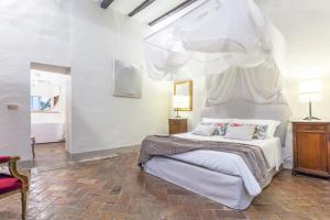 Postel nebo postele na pokoji v ubytování B&B dei Papi Boutique Hotel