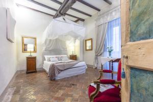 Postel nebo postele na pokoji v ubytování B&B dei Papi Boutique Hotel