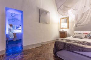 Postel nebo postele na pokoji v ubytování B&B dei Papi Boutique Hotel