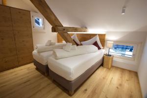 Posteľ alebo postele v izbe v ubytovaní adler alpen apartments