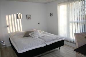 Кровать или кровати в номере Sov Godt i Arnborg Bed & Breakfast