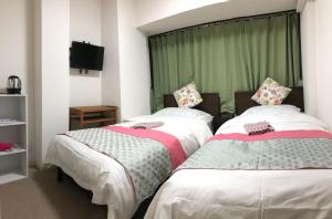Postel nebo postele na pokoji v ubytování GreenHotel
