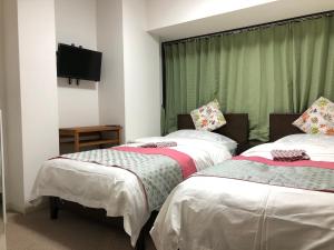 Postel nebo postele na pokoji v ubytování GreenHotel