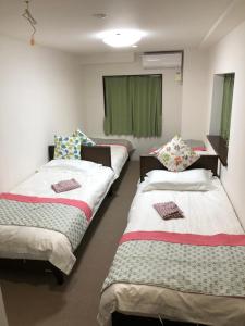 Postel nebo postele na pokoji v ubytování GreenHotel