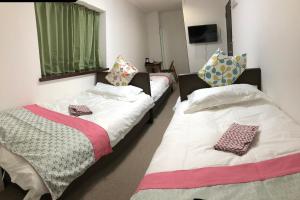 Postel nebo postele na pokoji v ubytování GreenHotel
