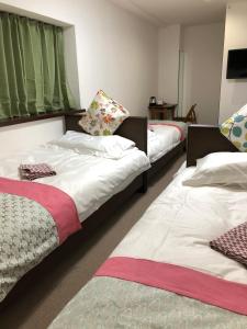 Postel nebo postele na pokoji v ubytování GreenHotel