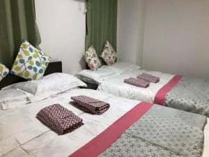 Postel nebo postele na pokoji v ubytování GreenHotel