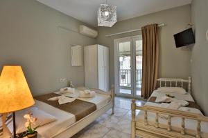 Säng eller sängar i ett rum på Villa Elena