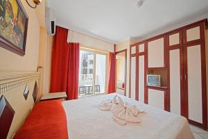 Postel nebo postele na pokoji v ubytování Selen Hotel