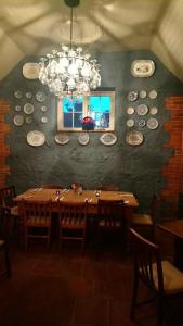 a dining room with plates on the wall at The Three Horseshoes in Warham