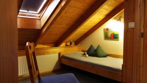 a bedroom with a bed in the attic at BioDohrn in Bad Zwischenahn