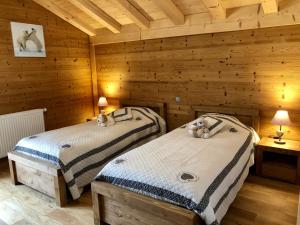 Säng eller sängar i ett rum på Chalet Luxe Les Mélèzes