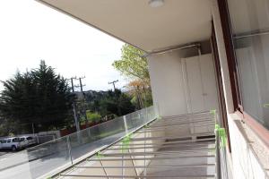a balcony of a building with a view of a street at Departamentos Parts Concepción in Concepción