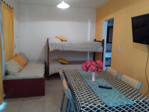 a room with a table and a couch and bunk beds at El VIEJI in Colón +40 photos