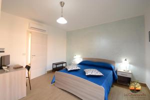 Letto o letti in una camera di La Chianarella