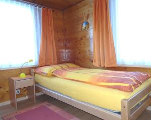 Posteľ alebo postele v izbe v ubytovaní Sunnegga