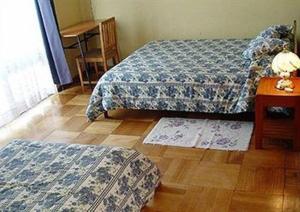 Cama o camas de una habitación en Hostal Casa Kolping
