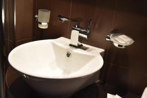 a bathroom with a white sink in a room at B&B Park in Sremčica