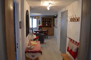 a hallway with a living room and a dining room at Coeur d'Alsace 3 in Kaysersberg