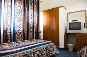 Postel nebo postele na pokoji v ubytování Victoria Hotel