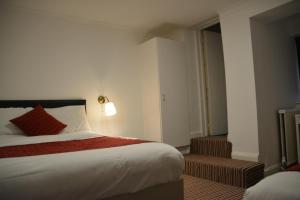 Postel nebo postele na pokoji v ubytování Bow Guest House