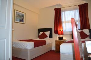 Postel nebo postele na pokoji v ubytování Bow Guest House