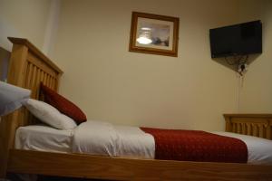 Postel nebo postele na pokoji v ubytování Bow Guest House