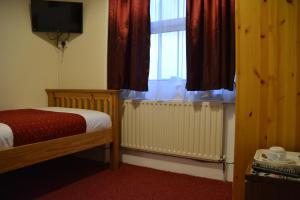 Postel nebo postele na pokoji v ubytování Bow Guest House