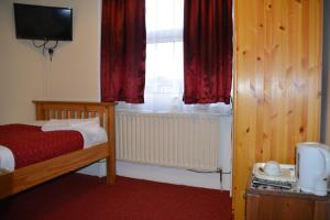 Postel nebo postele na pokoji v ubytování Bow Guest House