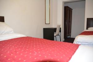 Postel nebo postele na pokoji v ubytování Bow Guest House