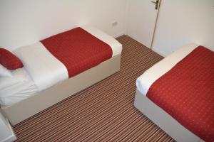 Postel nebo postele na pokoji v ubytování Bow Guest House