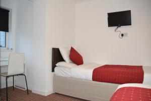 Postel nebo postele na pokoji v ubytování Bow Guest House