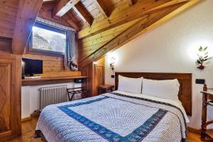 מיטה או מיטות בחדר ב-Hotel Lo Campagnar