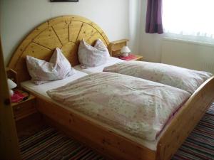 a bedroom with two twin beds with pillows on them at Bauernhof Manuela Perner in Nussdorf am Attersee