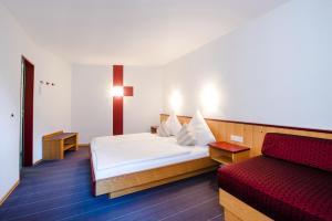 Ένα ή περισσότερα κρεβάτια σε δωμάτιο στο Hotel Gasthof zum Rössle