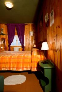 Un pat sau paturi într-o cameră la Hotel La Lucciola